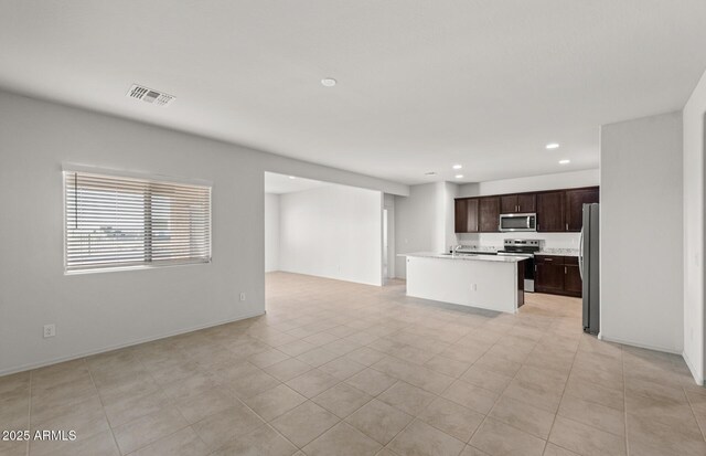 5053 S 252nd Ave, Buckeye, AZ 85326 - unfurnished living room featuring baseboards, visible vents, and recessed lighting