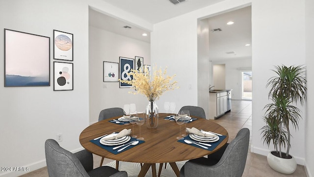 dining room with light tile patterned floors, visible vents, and recessed lighting