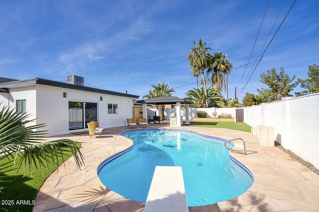6325 N 83rd Pl, Scottsdale, AZ 85250 - view of swimming pool with a diving board, a patio area, a gazebo, a fenced in pool, and a fenced backyard