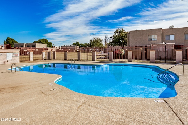 view of swimming pool with a patio area