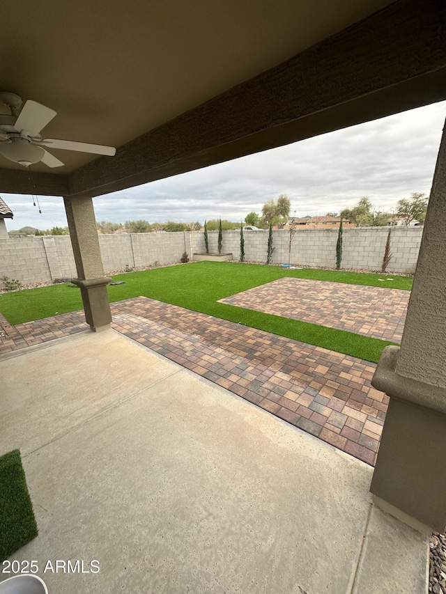 view of patio / terrace featuring a fenced backyard and a ceiling fan