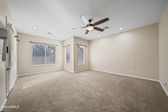 carpeted empty room with ceiling fan