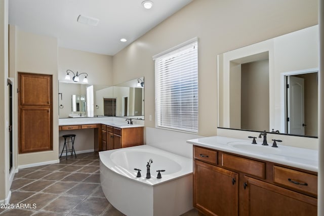 bathroom featuring vanity, a bath, and tile patterned floors