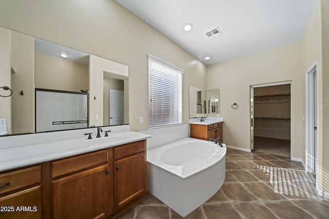 bathroom with vanity, shower with separate bathtub, and tile patterned flooring