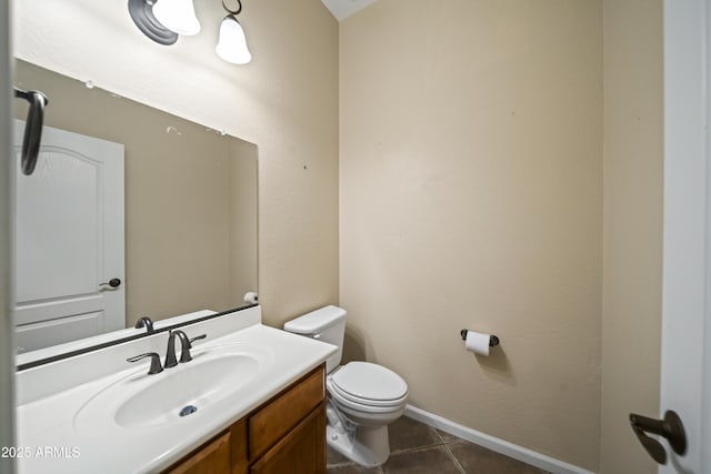 bathroom with tile patterned floors, vanity, and toilet