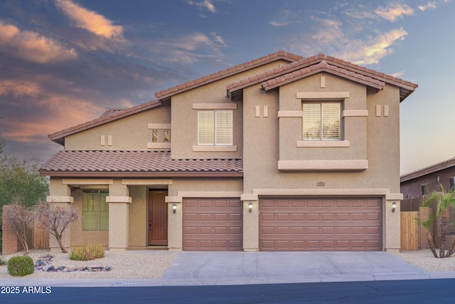 mediterranean / spanish-style house featuring a garage