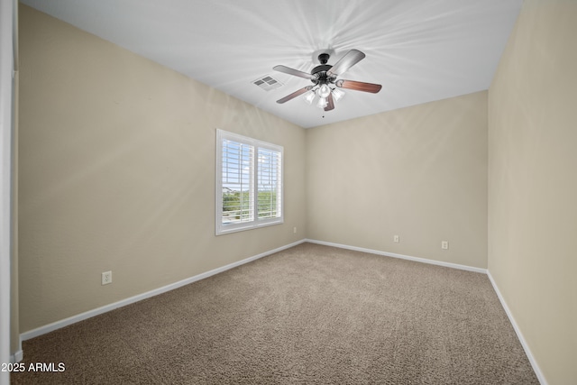 carpeted empty room featuring ceiling fan