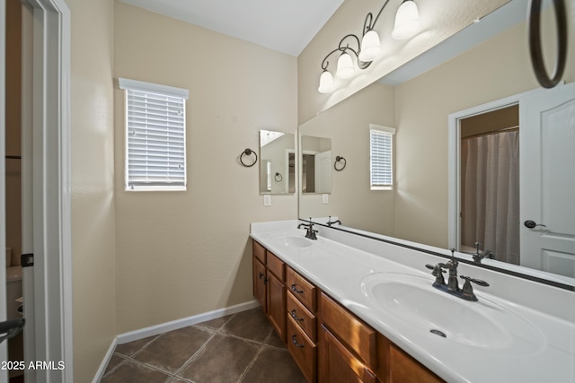 bathroom with tile patterned flooring and vanity