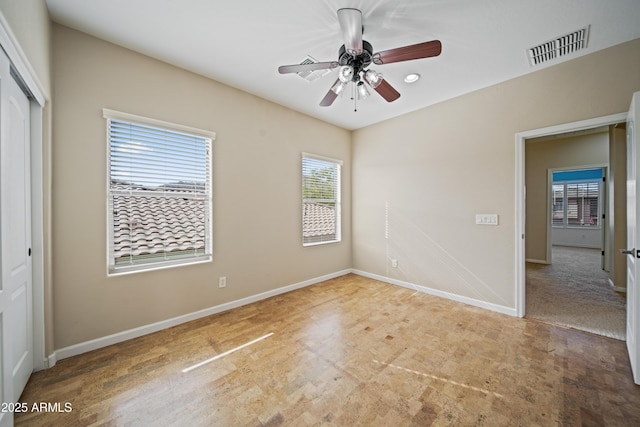 unfurnished bedroom with a closet and ceiling fan