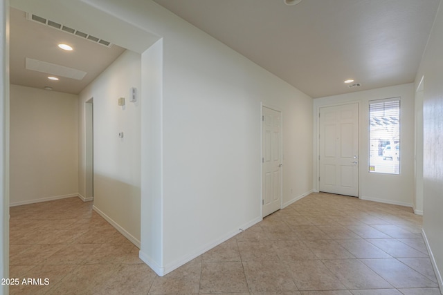 interior space featuring recessed lighting, visible vents, baseboards, and light tile patterned floors