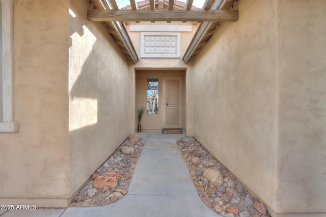 doorway to property with stucco siding