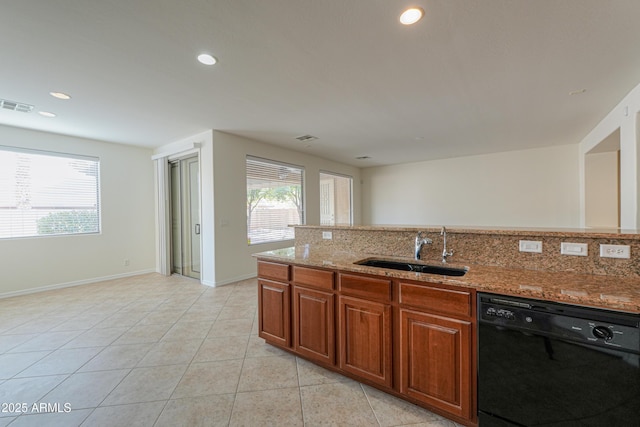 kitchen with black dishwasher, a wealth of natural light, visible vents, a sink, and light stone countertops