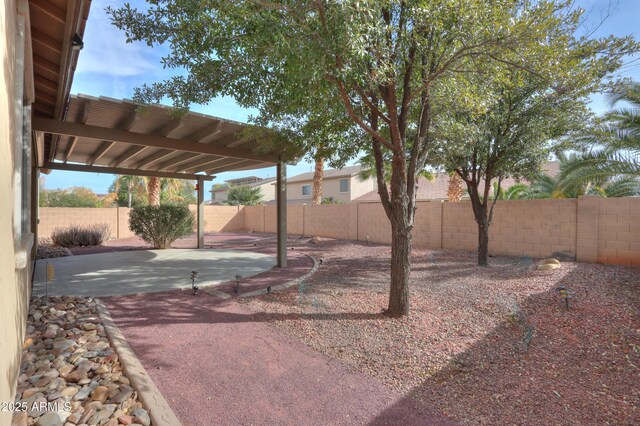 view of yard featuring a fenced backyard and a patio