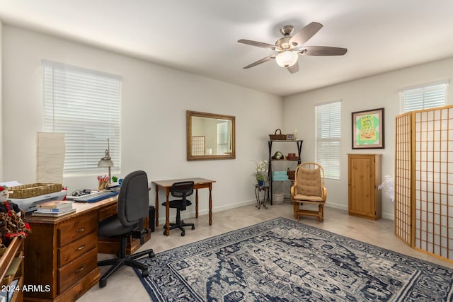 office with ceiling fan and light tile patterned floors