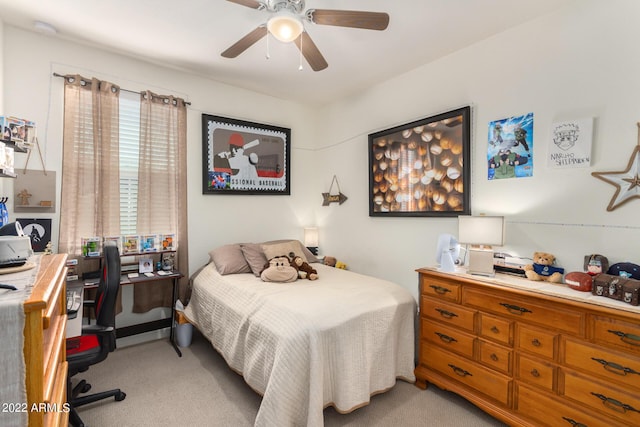 carpeted bedroom with ceiling fan