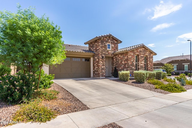 view of front of property featuring a garage