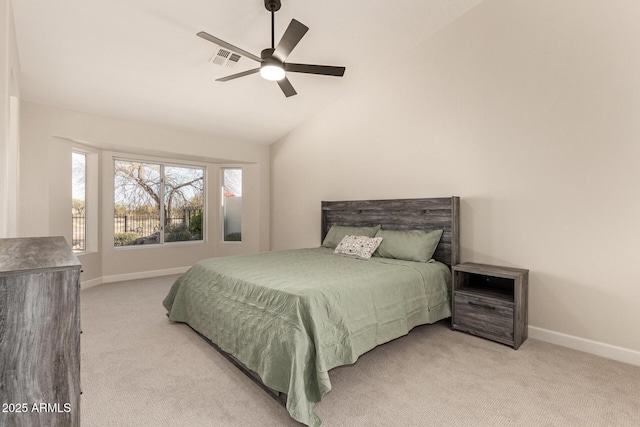 carpeted bedroom with lofted ceiling, ceiling fan, visible vents, and baseboards