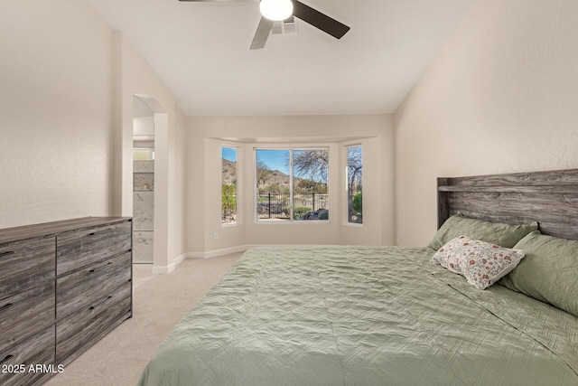 bedroom with arched walkways, visible vents, a ceiling fan, light carpet, and vaulted ceiling