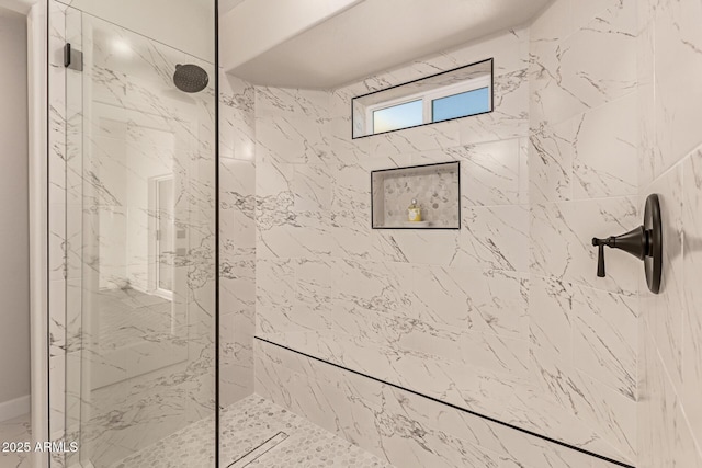 full bathroom featuring a marble finish shower