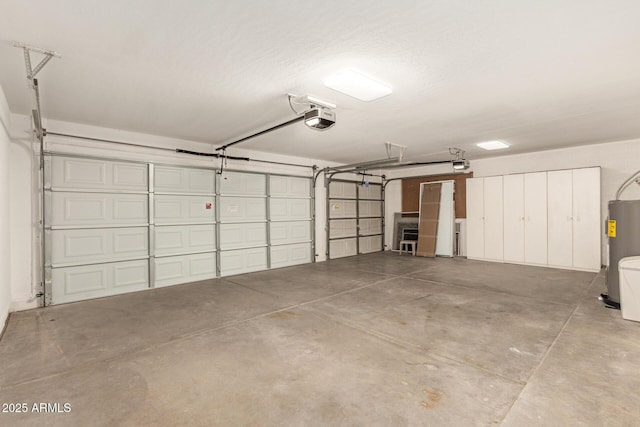 garage with water heater and a garage door opener