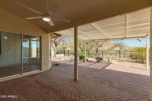 view of patio / terrace with a ceiling fan, fence, and a pergola