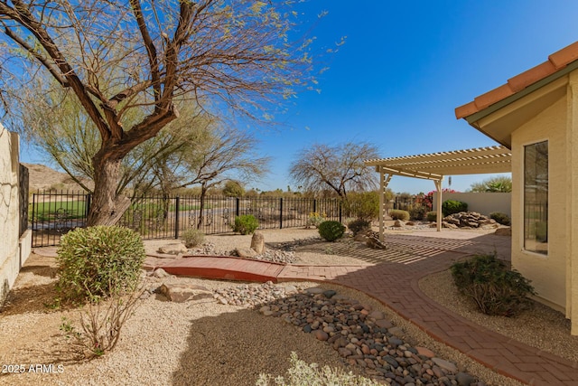 view of yard with fence, a pergola, and a patio