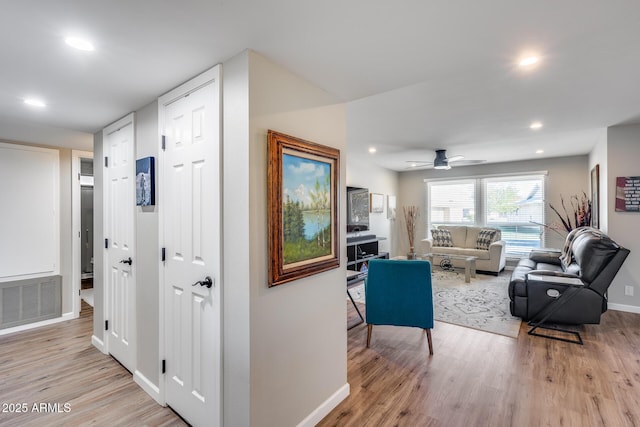 hall with light wood-type flooring