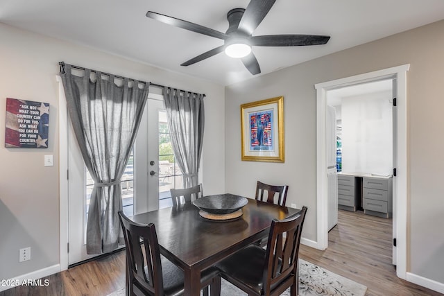 dining room featuring hardwood / wood-style flooring and ceiling fan