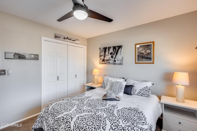 carpeted bedroom with a closet and ceiling fan