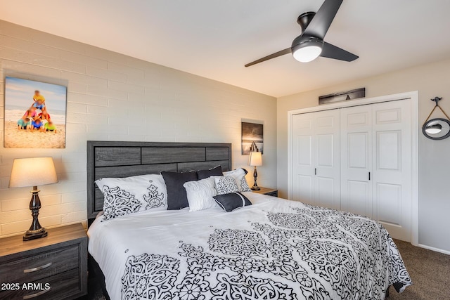 carpeted bedroom featuring a closet and ceiling fan