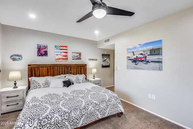 bedroom with ceiling fan and dark carpet