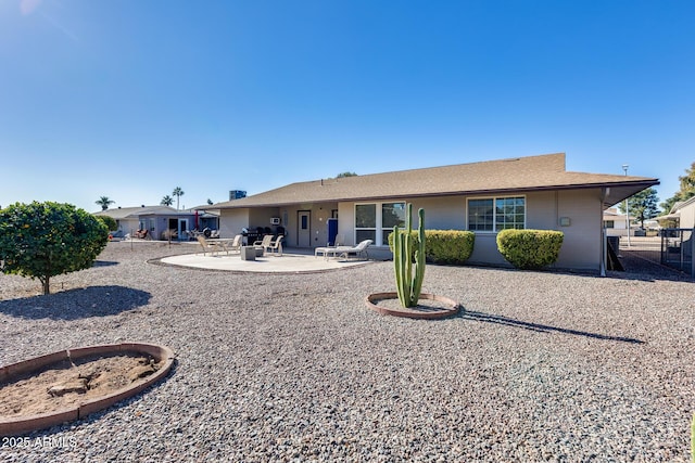 back of property with a patio area