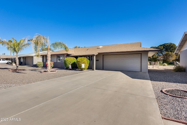 ranch-style house featuring a garage