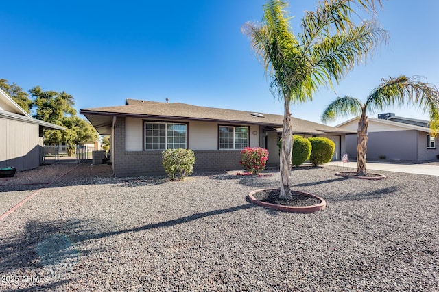 ranch-style house featuring central AC unit