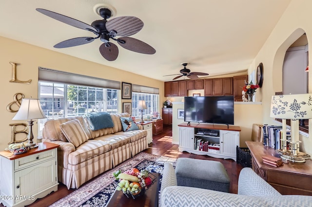 living room featuring ceiling fan and wood-type flooring