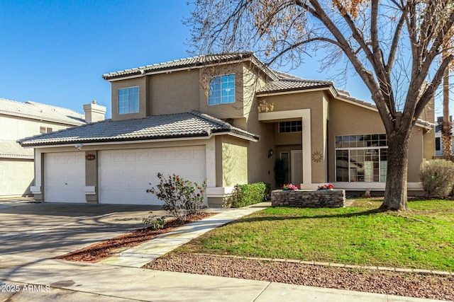 view of front of house with a garage and a front lawn