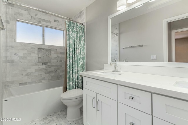 full bathroom with vanity, shower / tub combo, and toilet