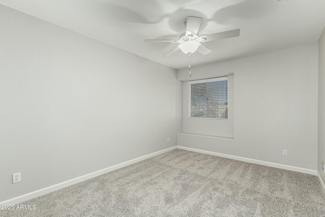 empty room with light colored carpet and ceiling fan