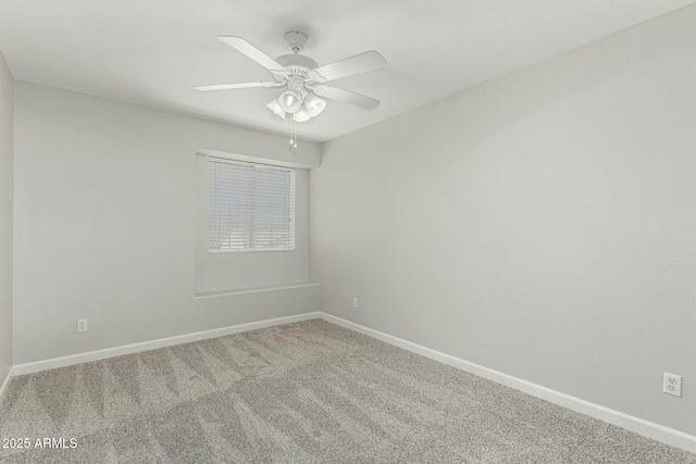 spare room featuring ceiling fan and carpet flooring