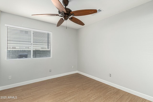 unfurnished room with hardwood / wood-style flooring and ceiling fan