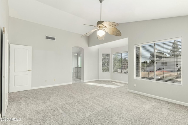 unfurnished room with lofted ceiling, light colored carpet, and ceiling fan