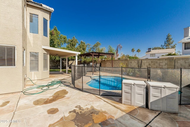 view of swimming pool featuring a pergola and a patio