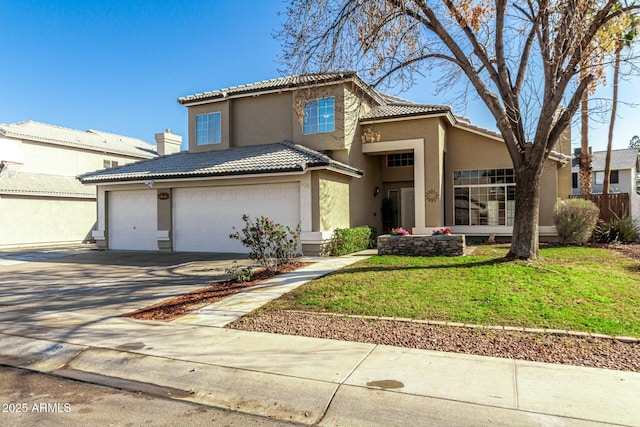 mediterranean / spanish house featuring a garage and a front yard