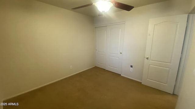 5374 N Ormondo Way, Litchfield Park, AZ 85340 - unfurnished bedroom featuring light carpet, a closet, and ceiling fan