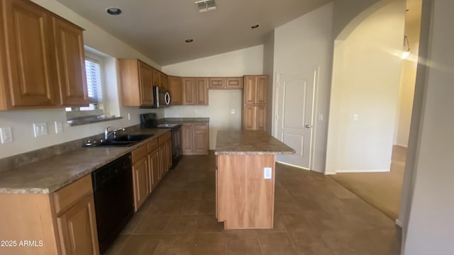 5374 N Ormondo Way, Litchfield Park, AZ 85340 - kitchen featuring range with electric cooktop, black dishwasher, stainless steel microwave, lofted ceiling, and a center island