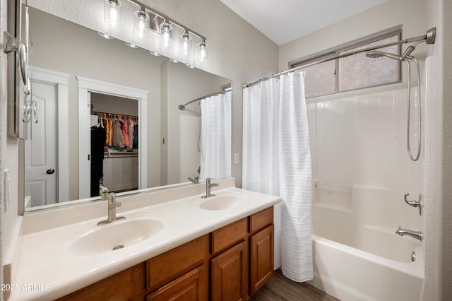 3773 E Stampede Dr, Gilbert, AZ 85297 - bathroom with shower / tub combo with curtain, double vanity, wood finished floors, and a walk in closet