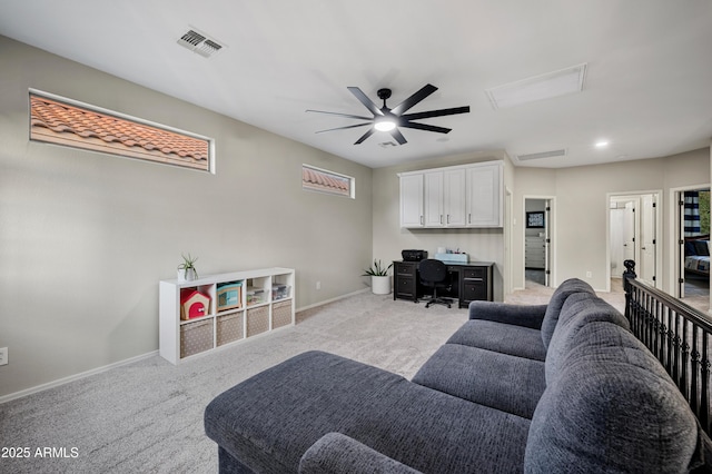 3773 E Stampede Dr, Gilbert, AZ 85297 - living area with an office area, ceiling fan, light colored carpet, and baseboards