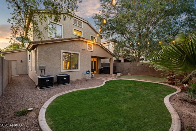 3773 E Stampede Dr, Gilbert, AZ 85297 - back of property with stucco siding, cooling unit, and a patio