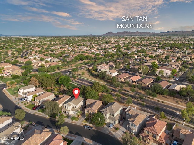 3773 E Stampede Dr, Gilbert, AZ 85297 - aerial view of property's location featuring a mountain backdrop and nearby suburban area