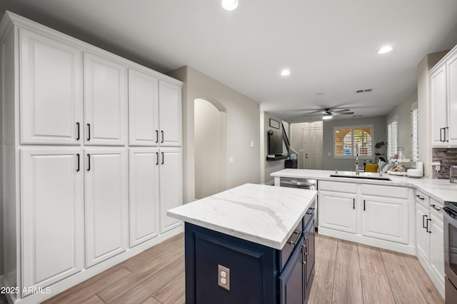 3773 E Stampede Dr, Gilbert, AZ 85297 - kitchen with blue cabinets, white cabinetry, a ceiling fan, and recessed lighting